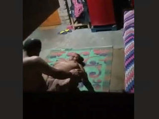 A neighbor's camera catches a couple from the village engaged in secret sexual activity