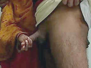 A maid from India performs a handjob and receives a facial cumshot