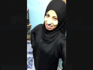 A Pakistani girl wearing a burka reveals and stimulates herself