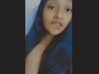 A horny brunette girl moans loudly while fingering herself