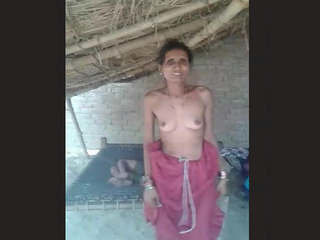 Elderly aunt displays her large breasts and vagina