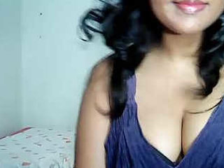 Indian wife reveals her large breasts while performing oral sex on her husband on camera