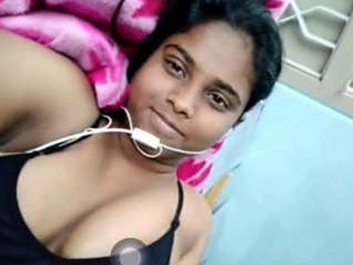 A seductive Indian beauty engages in a video chat