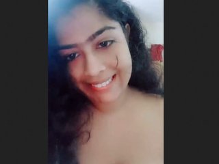 Indian college girl seductively displays her large breasts