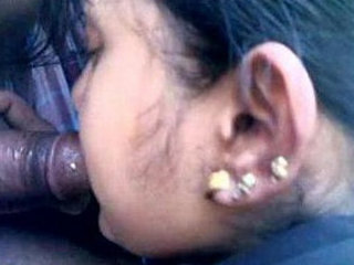 A stunning Indian woman gives oral pleasure in a vehicle