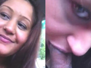 Alluring Indian aunt performs oral sex in a vehicle.