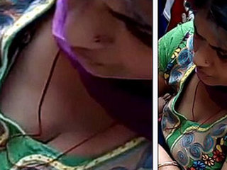 Cheeky mature woman flaunts her large breasts from above