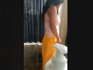 Indian sister prepares for a bath