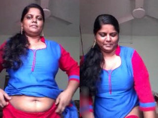 A seductive wife reveals her large breasts and intimate area to her partner