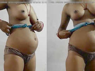 Expectant Indian wife displays breasts