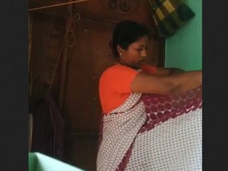 Elderly woman films herself changing clothes