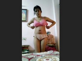 A young woman reveals her unshaved intimate area in this sensual recording