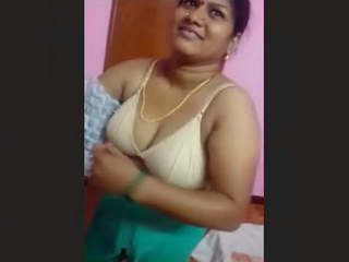 Indian wife transitions from one outfit to another