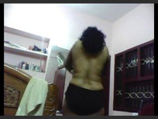 An Indian matron displays her expertise in changing blouses