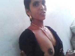A South Indian wife proudly displays her large breasts