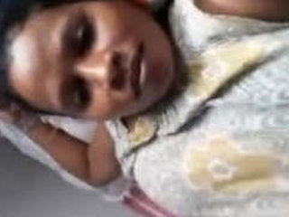 A seductive girl revealing her breasts and intimate parts