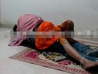 Madhavi's intimate encounter with her boyfriend while her husband watches