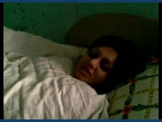 A recently married woman displays her legs wide open in an erotic video