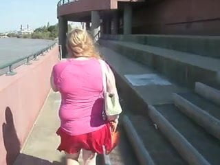 American girl strolls along the banks of the Ohio River on webcam