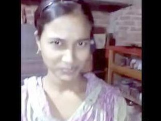 Desi couple's passionate kisses in a village setting