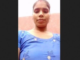 Bhabi in blue suit reveals her pussy in Indian porn video