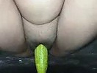 Desi babe enjoys the taste of cucumber in her vagina