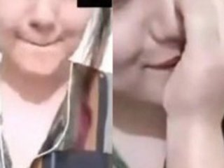 Pakistani girl fondles and sucks her breasts in a steamy video