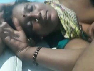 A mature couple enjoys each other's company in a hotel room