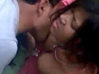 Horny couple indulges in boob play and sucking in park