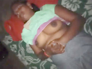 A timid wife with large breasts giving oral pleasure to her spouse