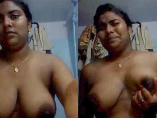 Tamil teenager fondles her breasts with a seductive look