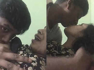 Indian couple indulges in passionate kissing and breast play