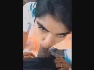 A pretty girl gives a blowjob in the great outdoors
