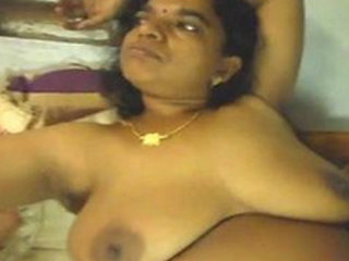 Mature Desi Aunty gets naughty in a village setting