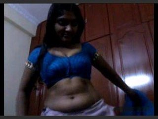 Indian aunty strips down and performs oral sex on a man